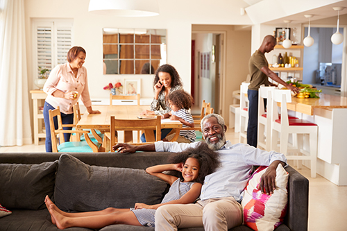 Family relaxing indoors after air conditioner repair Bay Head